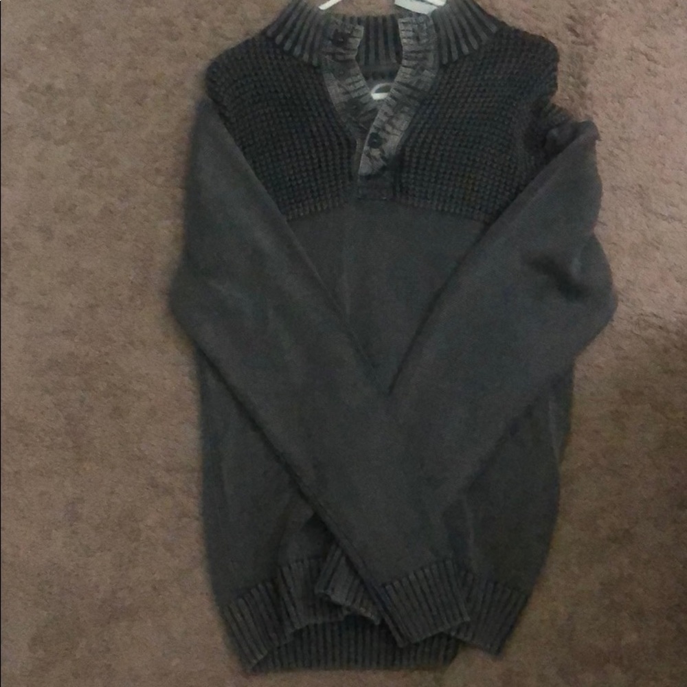 Buckle sweater.